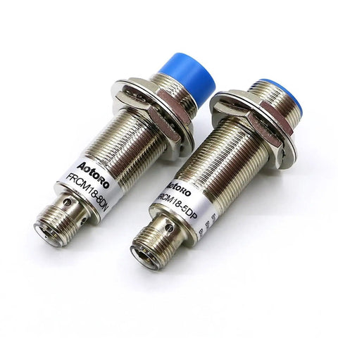 FRCM18-5DO M12 Connector Motion Inductive Proximity Sensor for Industrial Automation High Precision Detection Fast Response Rugged Build Easy Plug In Ideal for Conveyor Lines and Machinery, two M18 metal cylindrical sensors with blue caps