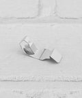 12 Pack Photo Frame Clips Picture Hanger Fastener Artwork Back Plate Fixing Hardware Metal Spring Turn Clip Hanging Supplies Silver Tone 35x13mm Ideal For DIY Frames Gallery Displays And Wall Art, close-up of one clip on white background.