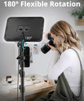Woman using the Two Pack LED Video Light Kit with 20W Ring Lights and 300 LEDs, showing 180 degree lamp head rotation feature.