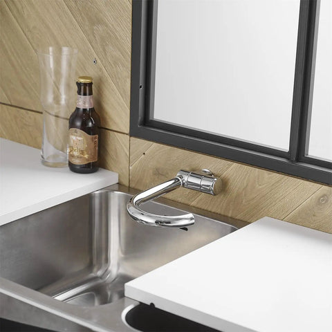 Premium RV Sink Faucet with Spotless Chrome Finish Heavy Duty 360 Swivel Marine Cold Water Tap Compact Deck Mount Setup for Camper Van Yacht and Weekend Road Trips installed in a modern kitchen.