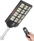 Ultra Bright 800W Solar Street Light With Motion Sensor And Remote Control, 1150 LED Solar Flood Lights Outdoor. Hand holding remote.