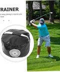 Portable Golf Impact Training Bag Swing Trainer in black used outdoors, golfer practicing swing on grass.