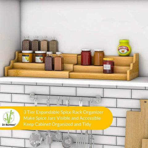 Expandable 3 Tier Bamboo Spice Rack And Kitchen Cabinet Organizer Fits Standard Jars Horizontally on kitchen shelf with jars.