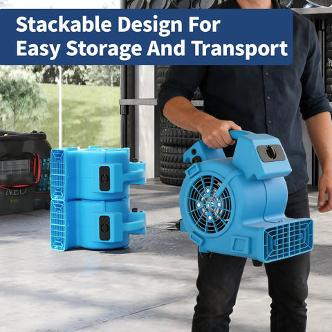 Man carrying a Powerful Air Mover 1/8 HP 550 CFM Carpet Dryer and Floor Blower with stackable design for transport.