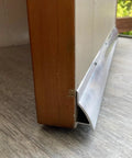 Heavy Duty Door Rain Drip Guard And Slim Drip Edge Cap To Keep Exterior Door Bottoms Bone Dry And Kick That Backing Flood Water Straight Past Your Entryway Today mounted on wooden door frame.