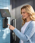 Woman installing 13200mAh Solar Charging Base Station for Blink Doorbell 2nd Gen, with 4W solar panel, IP67 waterproof unit on wall