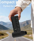 Cordless Compressed Air Duster With Up To 130000 RPM Dust Busting Portable Mini Blower held by person outdoors.