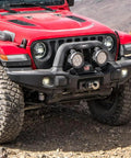 Off-road Jeep with AEV Winch Hook Isolator Fairlead Protector Hook Stopper For Off Road Winching on front bumper, rocky terrain