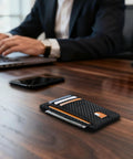 Ultra Slim Front Pocket Wallet For Men, RFID Blocking Credit Card Holder in carbon fiber design on office desk