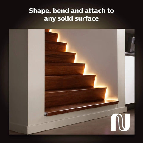 Staircase illuminated with Bluetooth 9ft Lightstrip Starter Kit With Hub For Hue Lighting, creating smart ambience.