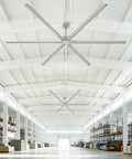 No Sweat 120 Inch HVLS Ceiling Fan For Shops And Gyms, large silver fan with aluminum blades in a spacious warehouse.