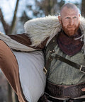Medieval Sword Holster Back Strap for Shoulder or Crossbody worn with fur cloak; leather belt visible