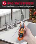 Pro Grade Digital Meat Thermometer With 2 Inch Auto Rotating Backlit Display rinsed under faucet, showing IP65 waterproof feature