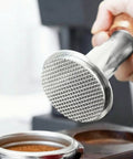 Straight Up 58mm Espresso Tamper For Dead On Pulls Daily Brushed Stainless Steel Coffee Press with solid wood grip in use