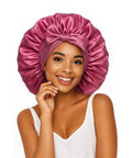 Woman wearing a Dark Pink Silk Sleep Bonnet For Women With Adjustable Straps And Tie Band, Large Hair Wrap for all night comfort
