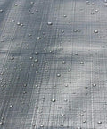 Close-up of Heavy Duty Reversible Tarp 16 by 20 in Silver Brown, 10 Mil Polyethylene with water droplets emphasizing weatherproofing