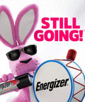 Energizer bunny character holding Energizer Max battery with a drum, promoting energy and reliability in toys.