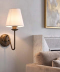 YS.ESUDSI Vintage Wall Sconces with White Handmade DIY Fabric Shade E26 mounted beside a couch in a stylish living room.