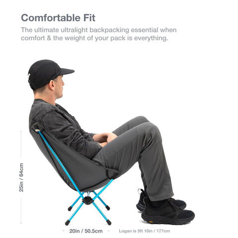 Man sitting in an Ultralight Backpacking Camp Chair That Packs Smaller Than a Water Bottle, Weighs Just 1.1 Lbs, Durable DAC Aluminum Folding Frame. Side view.