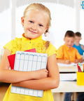 Girl holding Dry Erase Division And Place Value Whiteboards 9x12 Inch Double Sided Lapboards in classroom