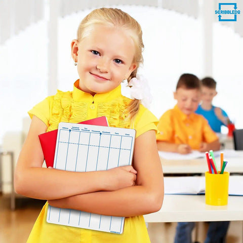 Girl holding Dry Erase Division And Place Value Whiteboards 9x12 Inch Double Sided Lapboards in classroom
