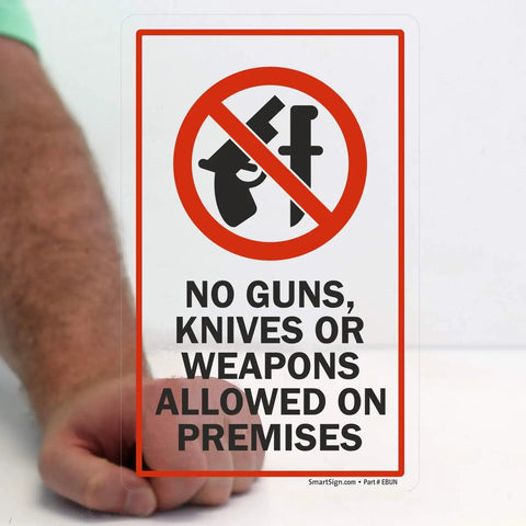 Hand holding Durable Polyester No Guns Knives Or Weapons Allowed On Premises Sign Decal For Inside Glass Application 5x8
