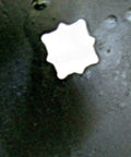Close-up of notched center hole of Notched 20 Inch Disc Harrow Blade For 1 Inch Or 1 And One Eighth Inch Square Axles, Four Millimeter Eight Gauge