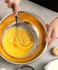 3 Pack Stainless Steel Balloon Whisks Set For Cooking, shown whisking egg in stainless steel bowl, 8 inch model, no tangling, reinforced construction