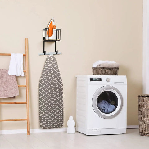 Wall Mount And Over The Door Ironing Board Holder With Large Storage Basket in a laundry room, holding iron and board, sleek black finish