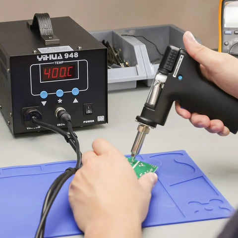 Efficient Desoldering Station With 80W Power, Auto Shutoff, and Precise Temperature Control in use on a circuit board