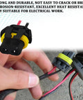 Close-up of Headlight Wiring Harness Kit For 9005 9006 9012 HB3 HB4 Plug Sockets Female Adapters with nylon shell and wiring.