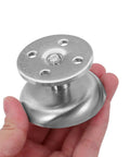 Hand holding a piece of Adjustable Round Stainless Steel Furniture Legs Set Of 4 For Cabinets And Sofas, Dope Stability And Easy Height Adjustment.