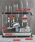 Mop And Broom Holder Heavy Duty Stainless Steel Tool Rack with Movable Organizer Storage, holding various cleaning tools.