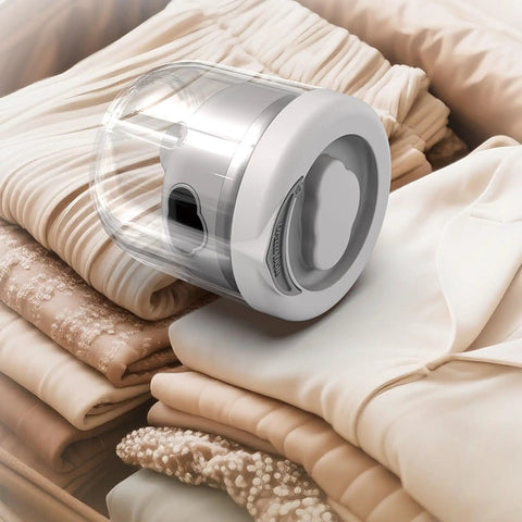 Mini Portable Washing Machine for Socks and Undies 1.6L Cordless USB Rechargeable Battery Operated Compact Laundry Washer beside folded clothes.
