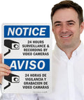 Skip The Drama Outside With Our 24 Hour Video Surveillance Sign 10X14 Inch Durable Aluminum Outdoor Security Plaque held by a smiling man.