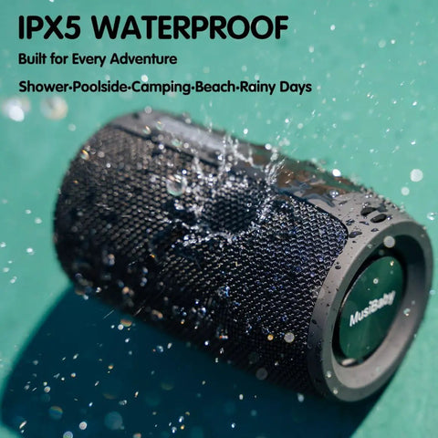 Compact Waterproof Portable Bluetooth Speaker That Goes Hard With Deep Bass, Dual Pairing, FM Radio, USB And AUX Input, 24 Hour Playtime with water droplets