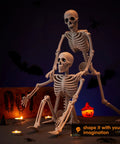 Two Pack 24 Inch Full Body Poseable Skeletons With Locking Joints For Halloween Indoor Outdoor Decor setup in spooky scene