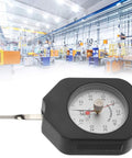 Dial Tension Gauge Pro-Grade With Dual Needle Dynamometer, 50g Peak Hold Tensiometer For Relay Switches, Spring Pressure And Tensile Testing, Durable Alloy Construction, Easy Peak Readings For Lab Or Shop, shown on factory floor