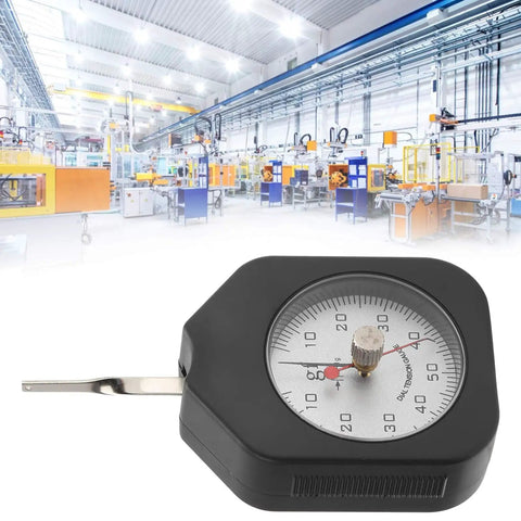 Dial Tension Gauge Pro-Grade With Dual Needle Dynamometer, 50g Peak Hold Tensiometer For Relay Switches, Spring Pressure And Tensile Testing, Durable Alloy Construction, Easy Peak Readings For Lab Or Shop, shown on factory floor