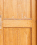 Gold finish aluminum handle on wooden door; part of Two Pack Aluminum Door Handle Pulls With Ergonomic Design And 128mm Hole Spacing.