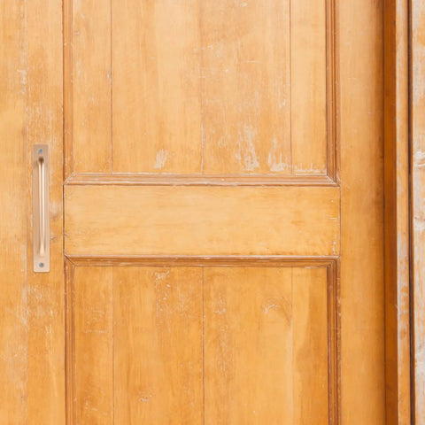 Gold finish aluminum handle on wooden door; part of Two Pack Aluminum Door Handle Pulls With Ergonomic Design And 128mm Hole Spacing.