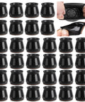 32 Pcs Chair Leg Protectors For Hardwood Floors Silicone With Felt Bottoms, shown in black, easy to install on furniture legs.