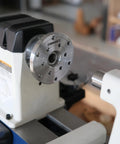 Heavy Duty 1x8Tpi Face Plate Kit For Woodturning Lathes Including 2 3 4 And 6 Inch Plates mounted on a wood lathe.
