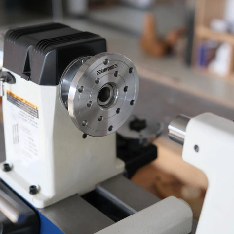 Heavy Duty 1x8Tpi Face Plate Kit For Woodturning Lathes Including 2 3 4 And 6 Inch Plates mounted on a wood lathe.