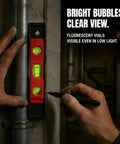 Spirit Level, 3, New Yellow Level 23CM with bright bubble vials, used for leveling near a pipe in low light.