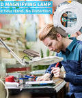Man using Lit 2200L LED Magnifying Lamp With Stand Real Glass Lens Dimmable Light for electronics repair in workshop