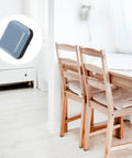 Furniture Sliders For Chairs And Tables 16 Pack No Slip PTFE And Iron Floor Protectors on wooden chairs by a table