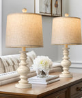 Super Cool Rustic Table Lamp Set Of Two With Vintage Farmhouse Vibes Perfect For Your Living Room Bedroom Or Nightstand In Small Spaces Features Antique White Resin Base And Linen Shade For Cozy Compact Decor, displayed on a wooden side table.