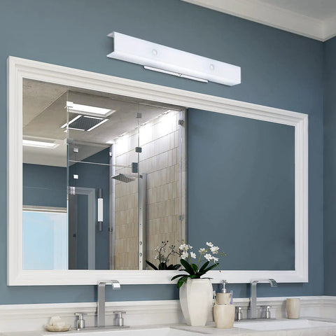 Four Light Interior Wall Fixture With Ground Convenience Outlet, White Ceramic Glass above bathroom mirror, white finish.