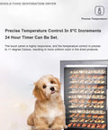 Heavy Duty Stainless Steel Food Dehydrator With 800 Watt Motor And 24 Hour Timer with precise temperature control and dog beside it.